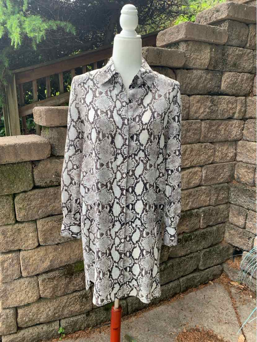 Long-sleeve button-up dress with black and white snake print and pointed collar.