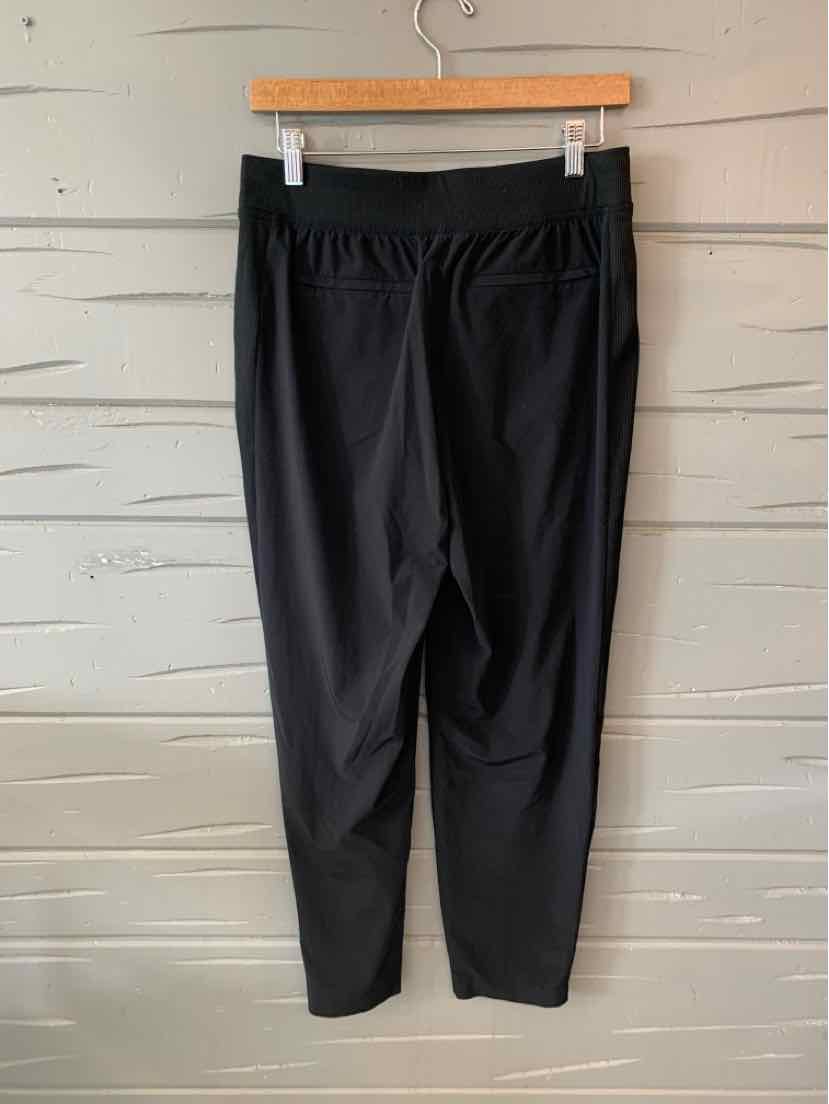 Black ankle-length athletic leggings with high waistband and slim fit, size 6.