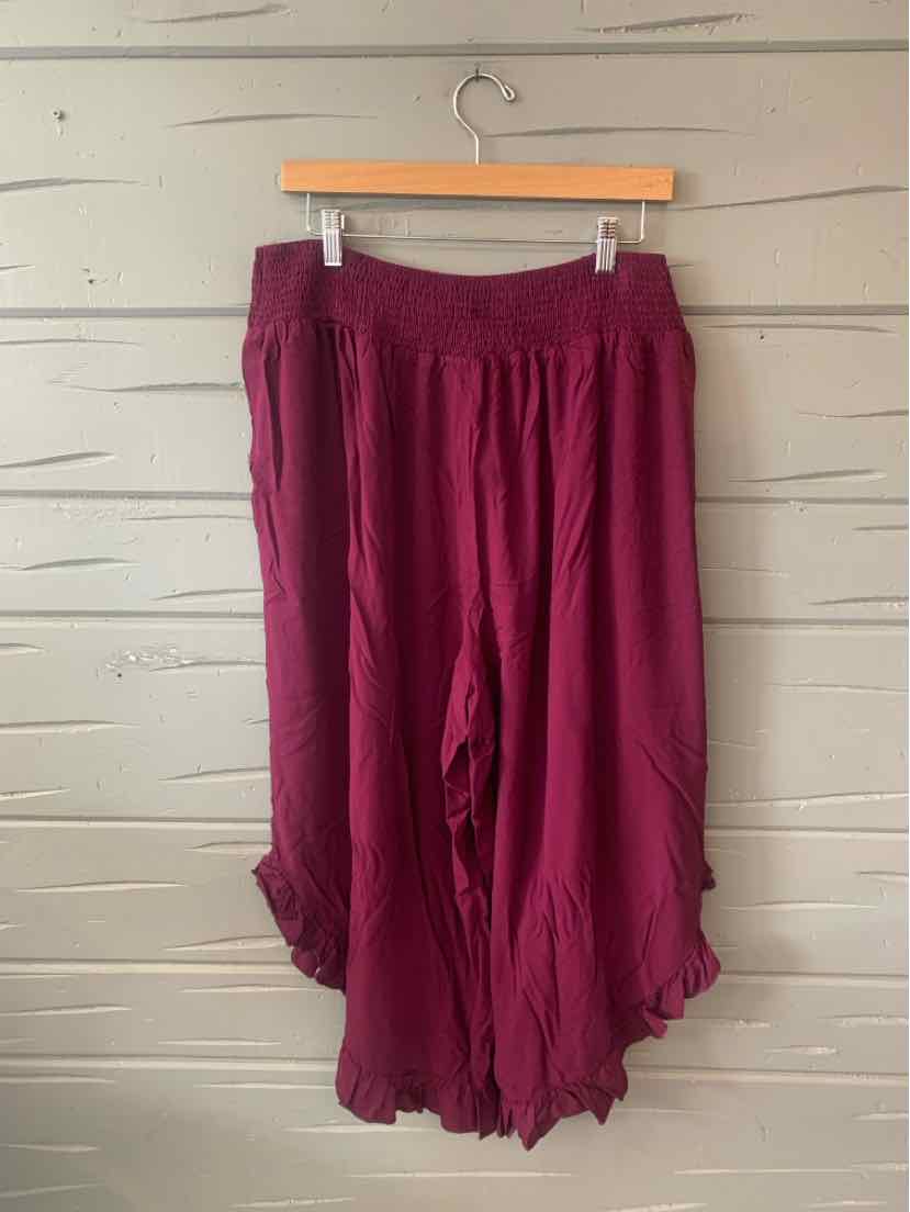 Deep magenta wide-leg pants with elastic waistband and ruffled hem, size 18-20.