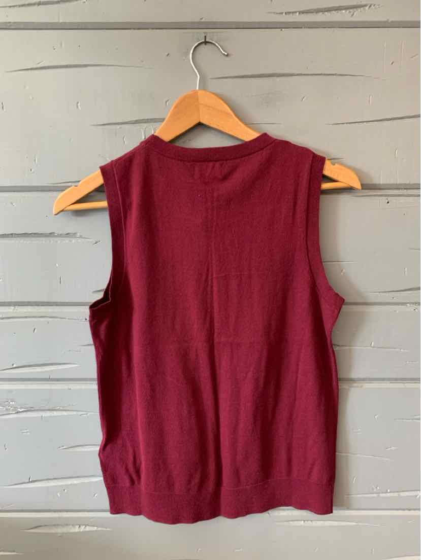 Sleeveless burgundy knit top with round neckline, ribbed hem, and relaxed fit.