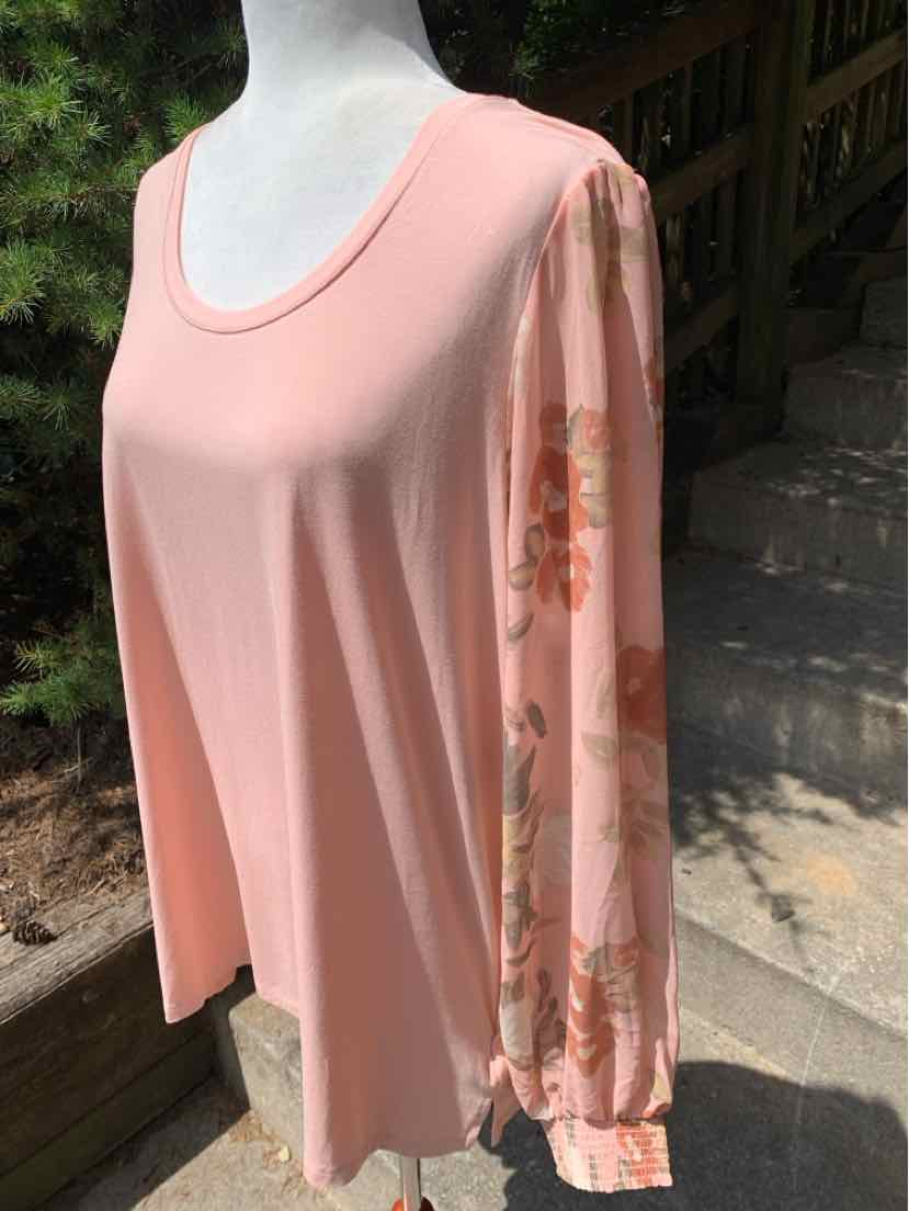 Light pink long-sleeve blouse with scoop neck and floral-patterned sleeves.