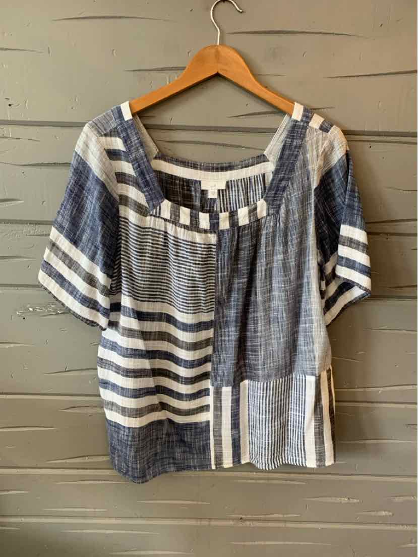 Blue and white striped short-sleeve blouse with mixed horizontal and vertical patterns, square neckline, and loose fit.