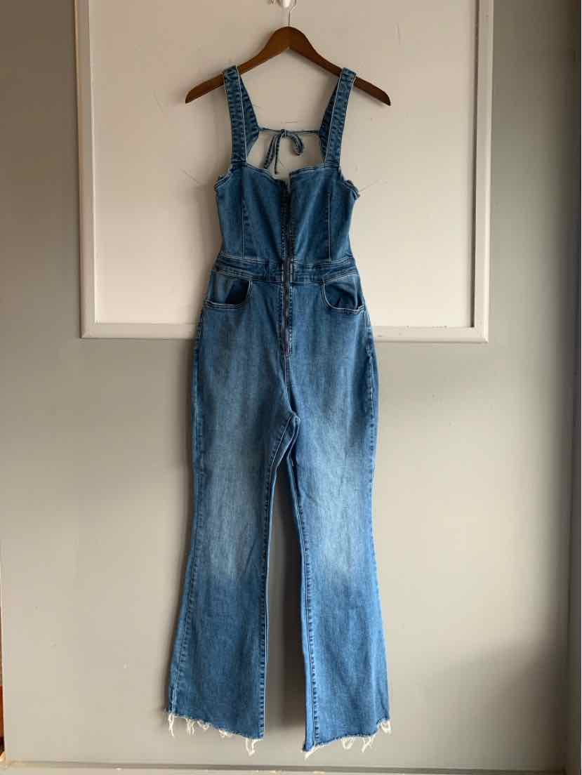 Blue denim overalls with adjustable straps, front chest pocket, and wide-leg cut with frayed hems.