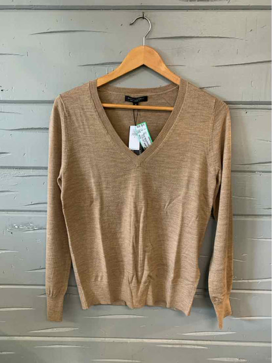 Tan V-neck long sleeve lightweight sweater in medium size on wooden hanger.
