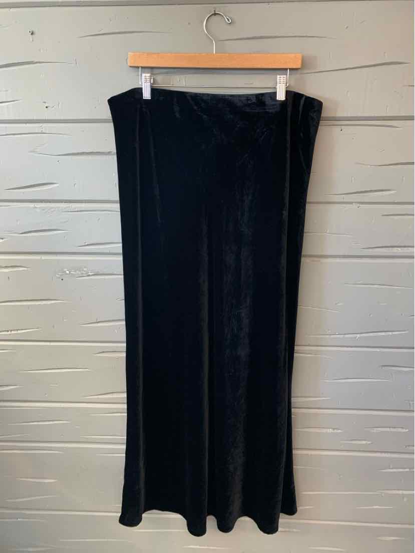 Black velvet maxi skirt with a straight silhouette and slight flare at hem, size 1X.