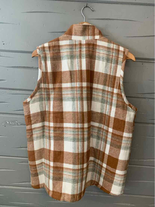 Sleeveless tan and white plaid flannel vest with a classic collar, size XL, hanging on wooden hanger.