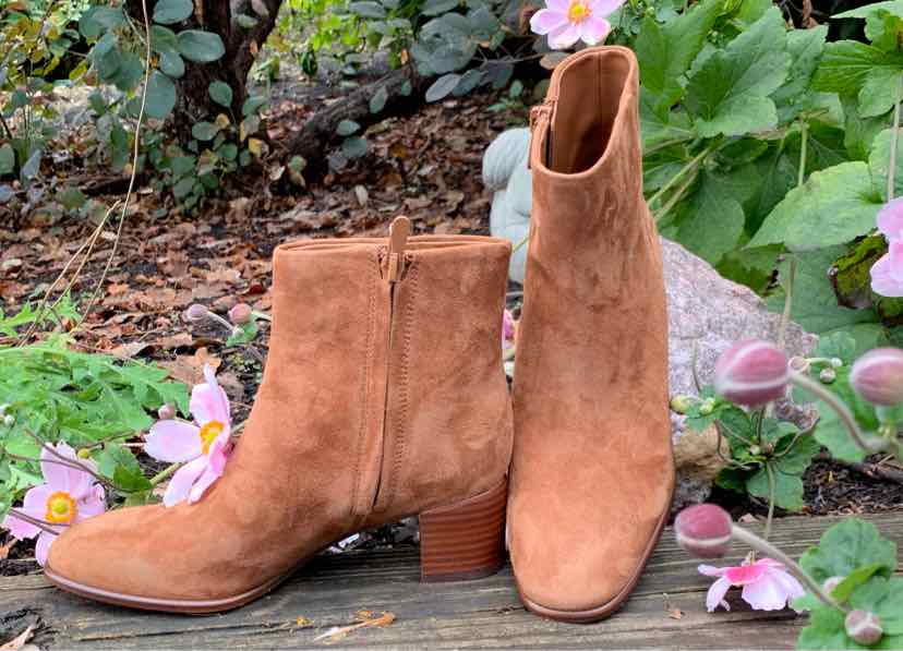 Tan suede ankle boots with stacked block heels and side zippers, size 5.
