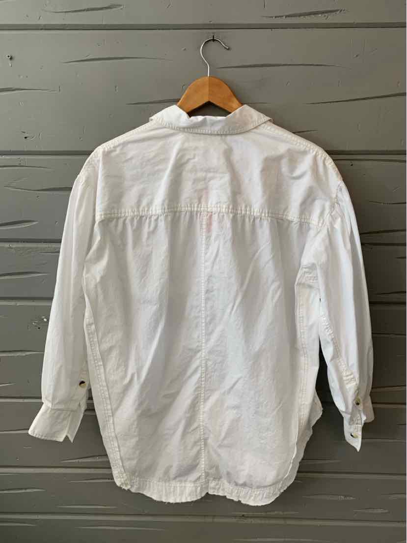 White long-sleeve button-up shirt with a classic collar and single-button cuffs on a wooden hanger.