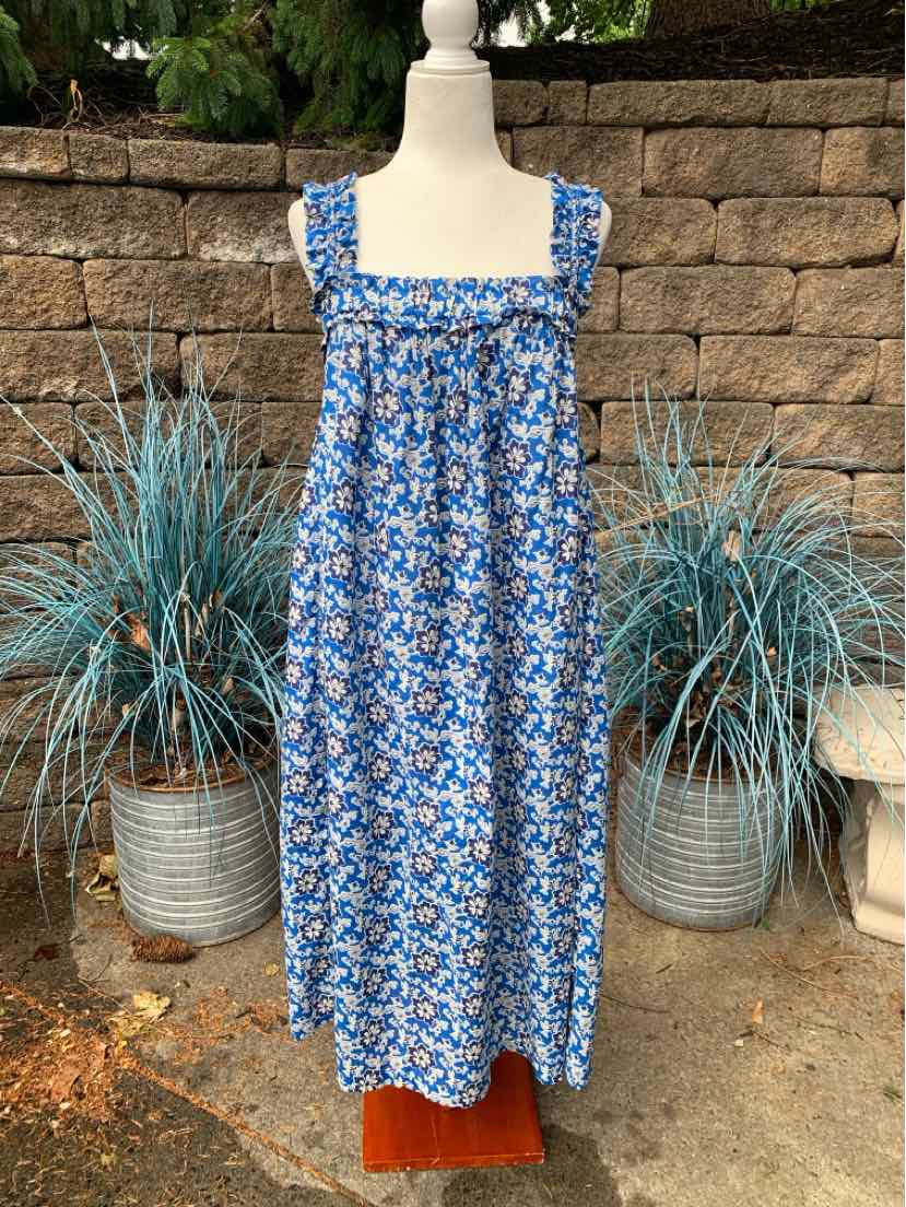 Blue floral sleeveless midi dress with square neckline and gathered bodice on mannequin.