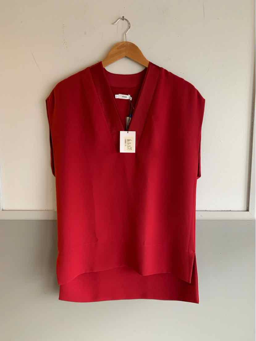 Red short-sleeve blouse with V-neck and relaxed fit on wooden hanger.
