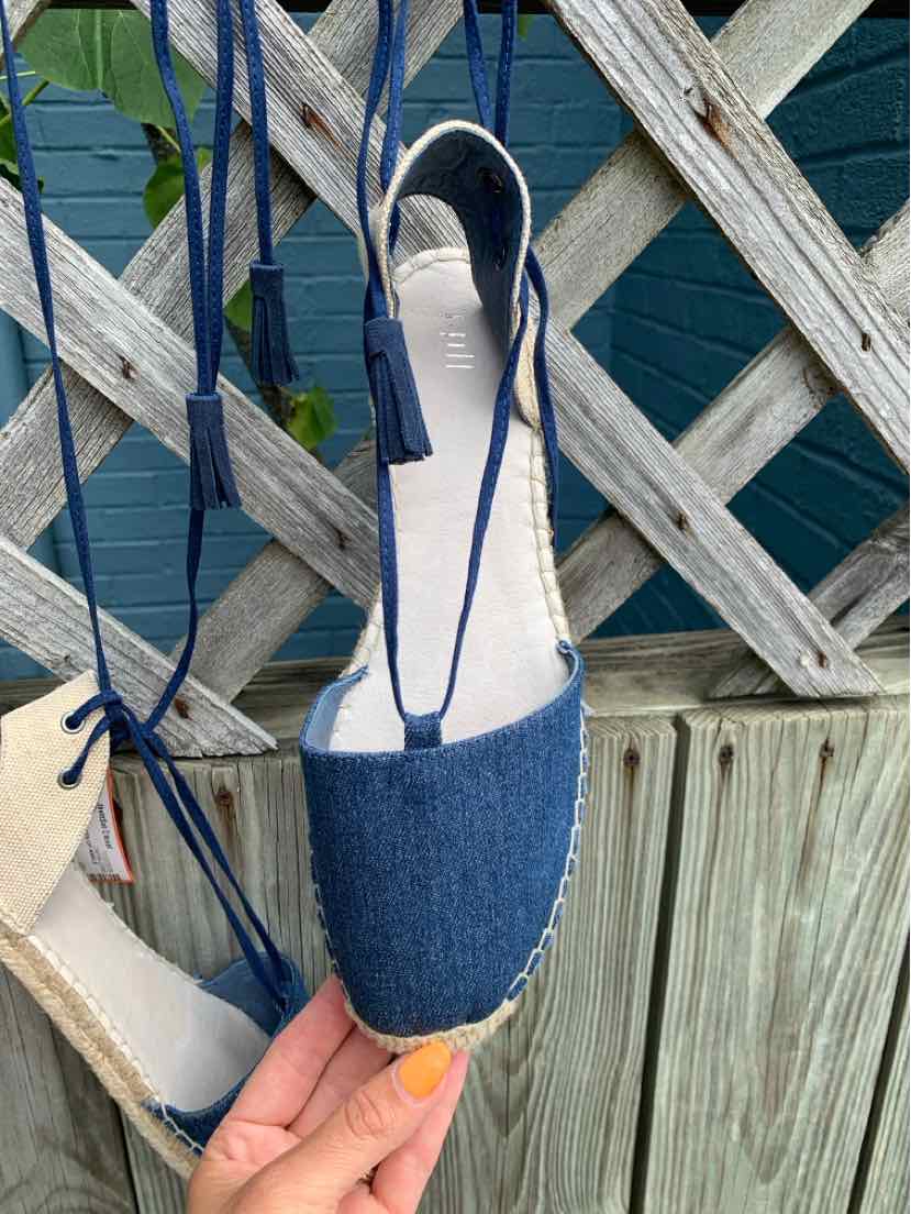 Blue denim espadrille flat with rounded toe and navy ankle ties.