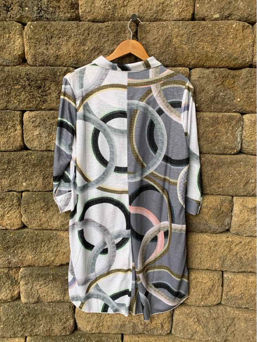 Long-sleeve hoodie dress with gray, white, and pastel multicolor overlapping circle patterns.