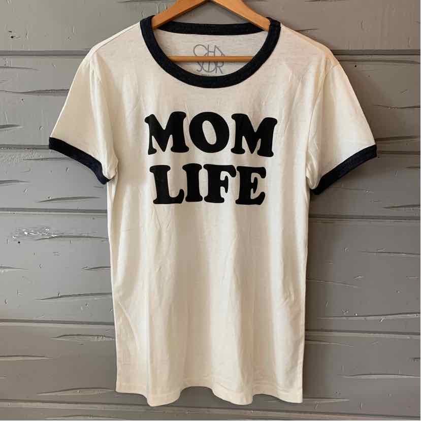 White short-sleeve T-shirt with black trim on collar and sleeves, "MOM LIFE" printed in bold black letters on front.