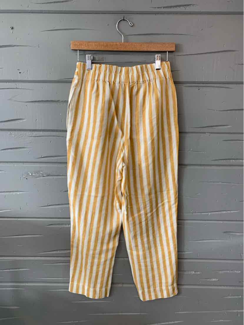 Yellow and white vertical striped lightweight casual pants with an elastic waistband and a relaxed fit.