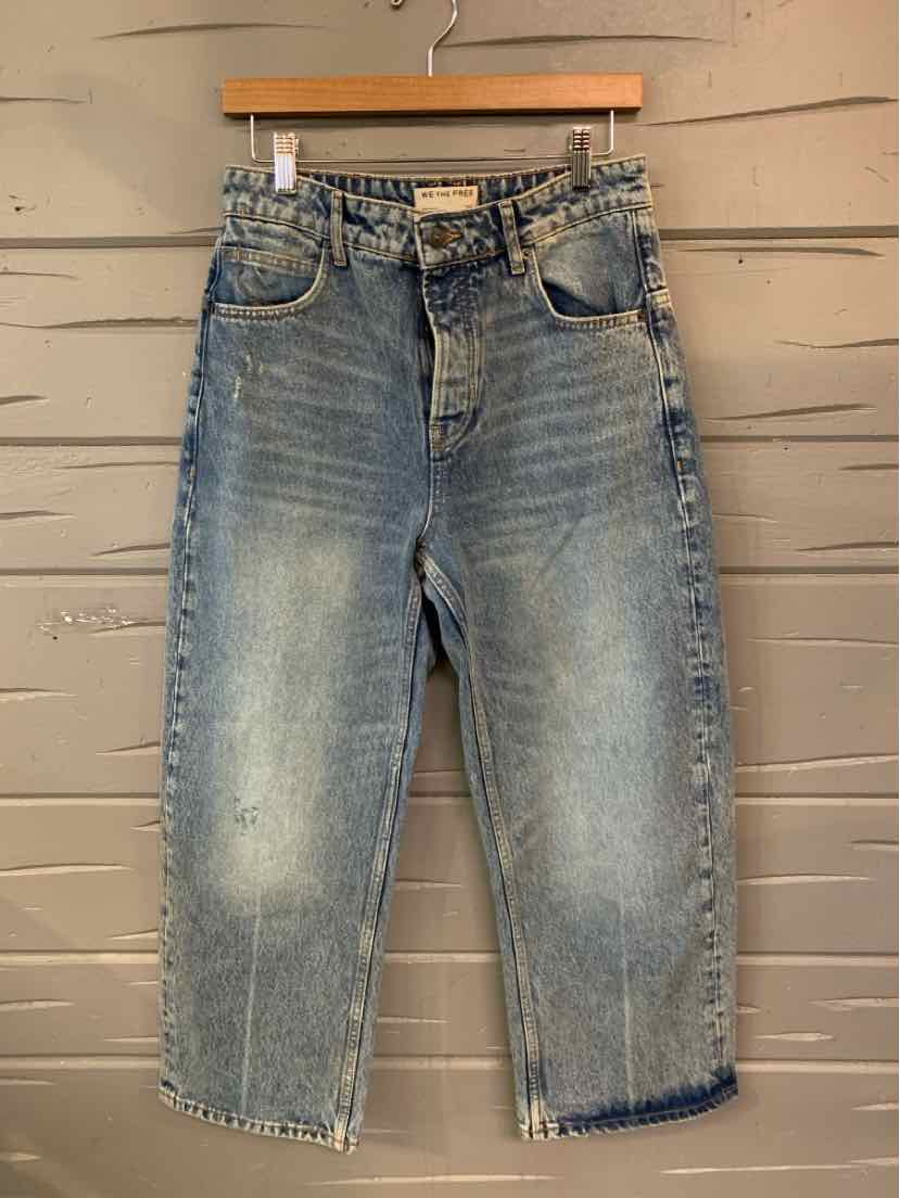 Light blue denim jeans with a relaxed fit, slight fading on thighs, and raw hem cuffs.