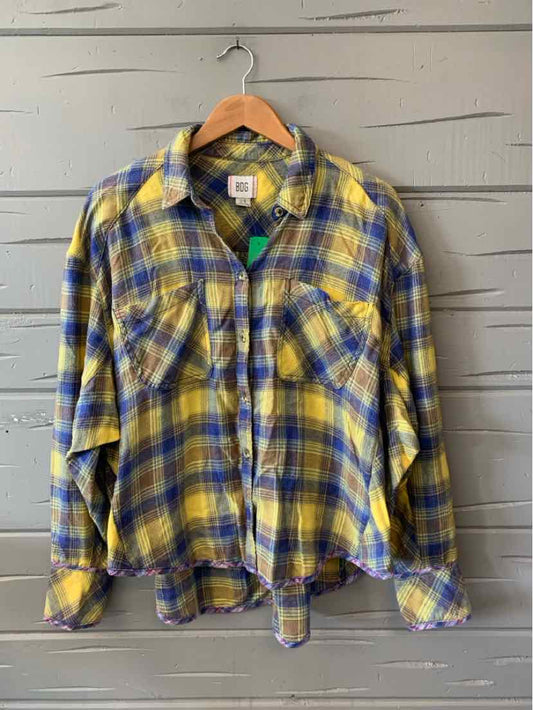 Yellow and blue plaid flannel shirt with long sleeves and two chest pockets, size large.