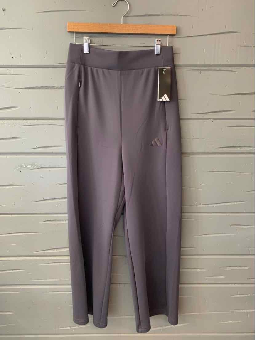 Gray high-waisted athletic leggings with smooth fabric and subtle Adidas logo on left thigh.