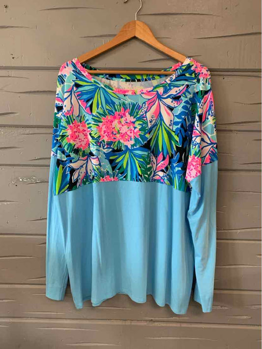 Light blue long-sleeve top with vibrant tropical floral print across the chest and shoulders, size XXL.
