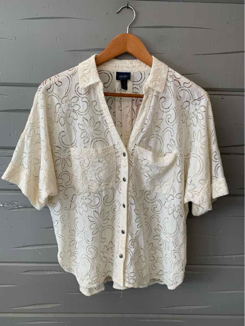 White semi-sheer lace short-sleeve blouse with collar and button-down front.