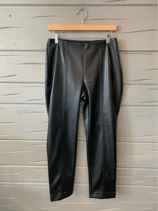 Black faux leather slim-fit pants with a smooth finish and mid-rise waistband.