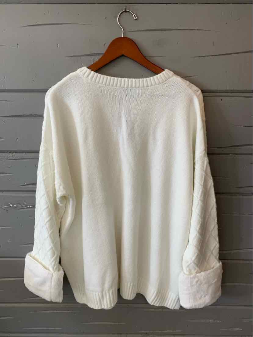 White knit sweater with a ribbed crew neck, dropped shoulders, and wide folded cuffs, shown from the back.