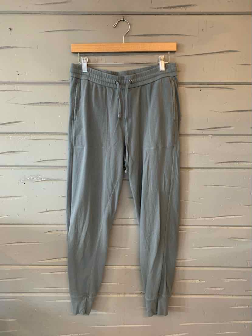 Light gray tapered jogger pants with elastic waistband and cuffs.