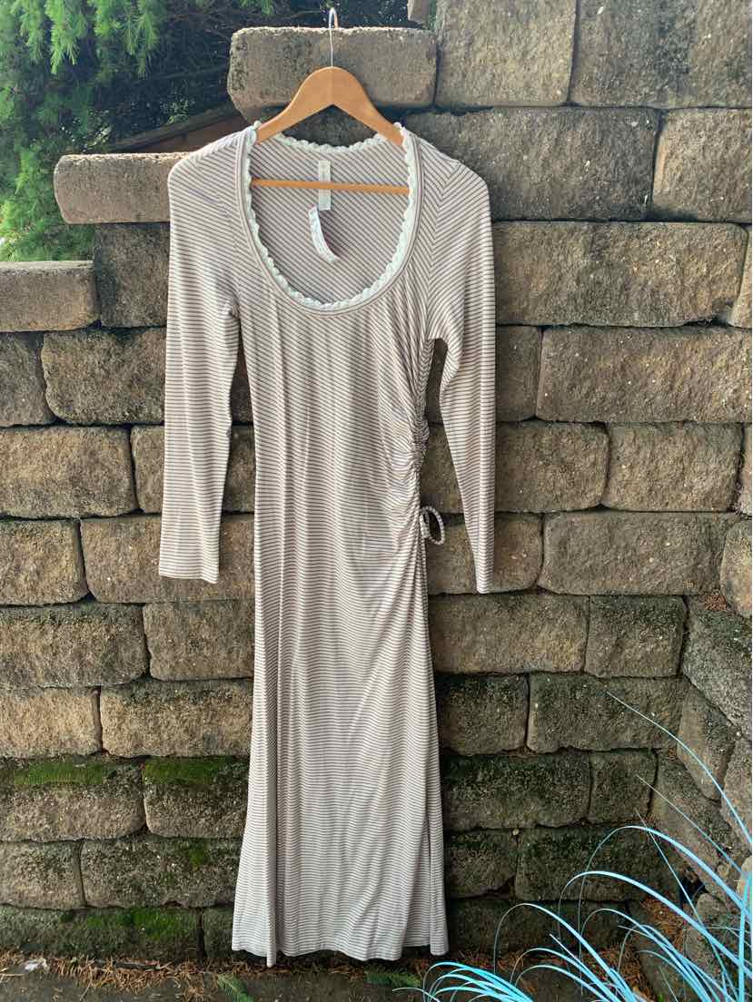 Mauve long-sleeve dress with scoop neckline and side ruching detail on lightweight fabric.