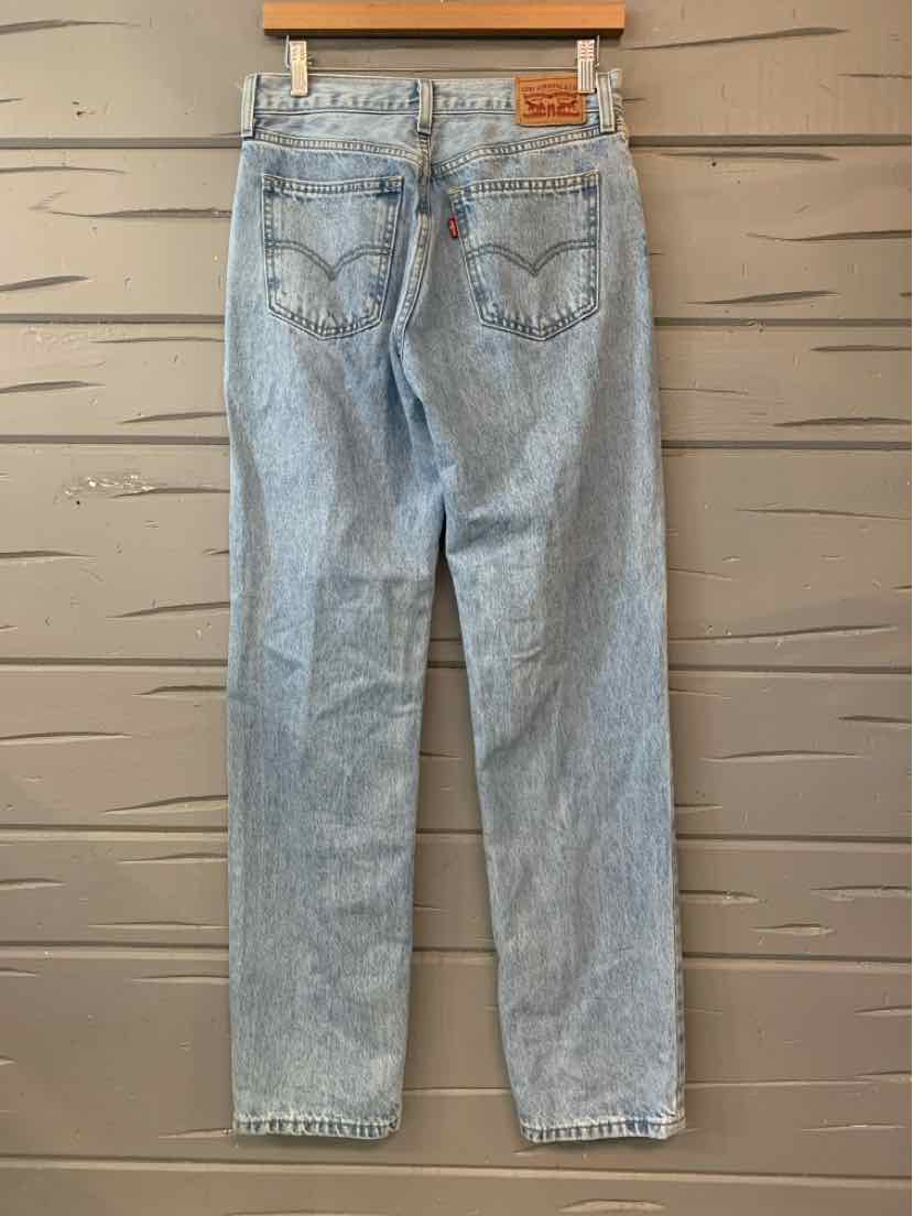 Light-wash blue Levi’s denim jeans with a straight-leg cut, back pockets, and a leather waistband patch.