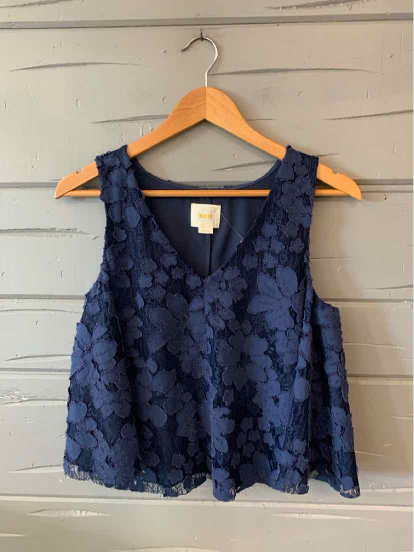 Navy blue sleeveless crop top with floral lace overlay and scalloped hem.