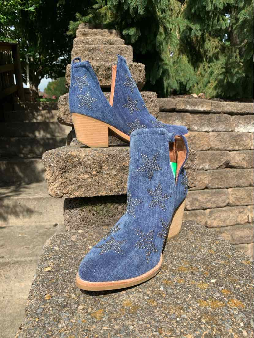 Blue suede ankle boots with star pattern, stacked wooden heel, side zipper, and pointed toes.