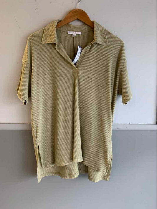 Light olive green short-sleeve polo shirt with collar and hidden front buttons, medium size.