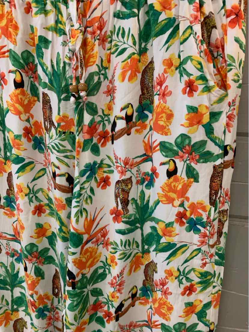 White fabric with vibrant orange and pink floral and green leafy jungle print dress in large size.