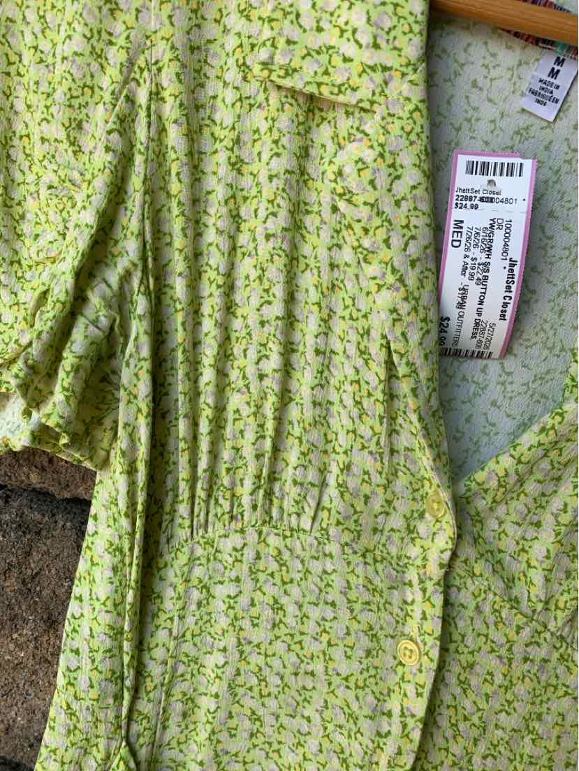 Light green floral dress with short sleeves and gathered waist, size medium, Urban Outfitters label visible.