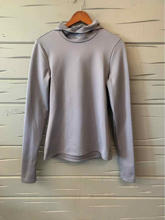 Light gray long-sleeve fitted top with high neckline, smooth fabric, and slight stretch.