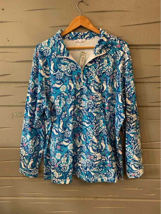 Blue zip-up jacket with white and light blue floral pattern, size 2X, hanging on wooden hanger.
