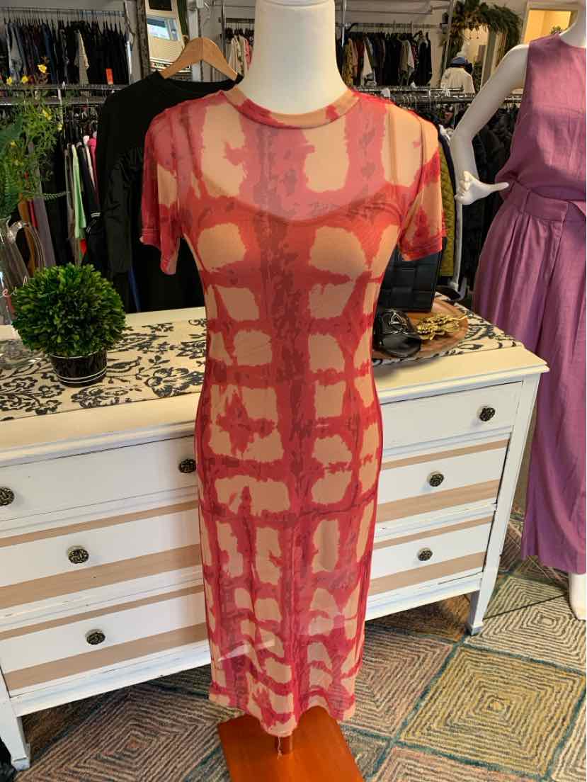 Red geometric patterned short-sleeve fitted midi dress on mannequin.