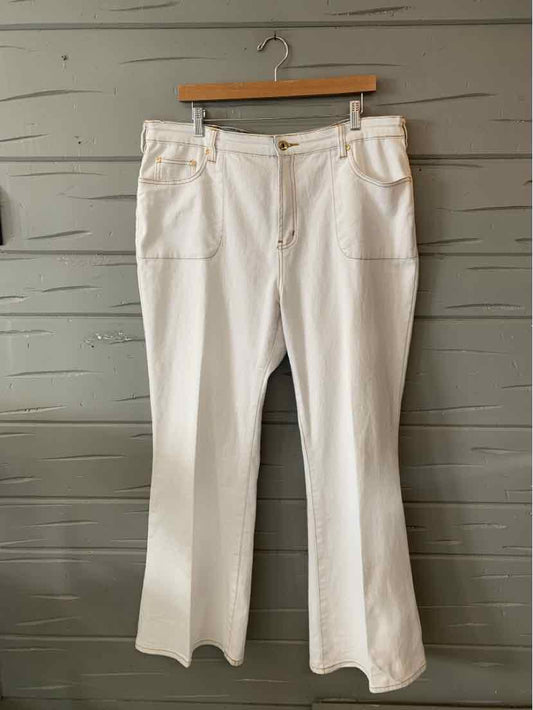White mid-rise pants with wide legs, front pockets, and button closure, size 18.