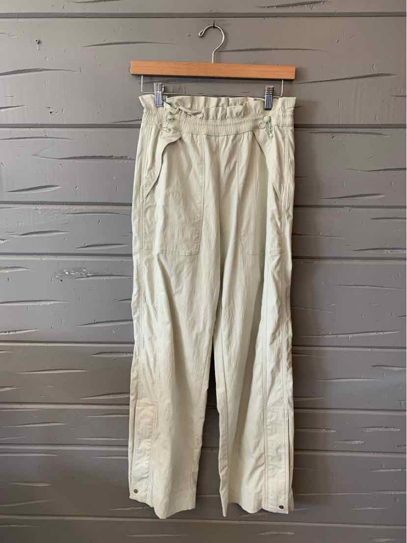 Light mint green high-waist athletic pants with gathered elastic waistband and straight legs.