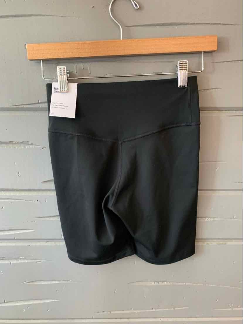 Black high-waist athletic shorts with wide waistband, smooth fabric, and slim fit style.