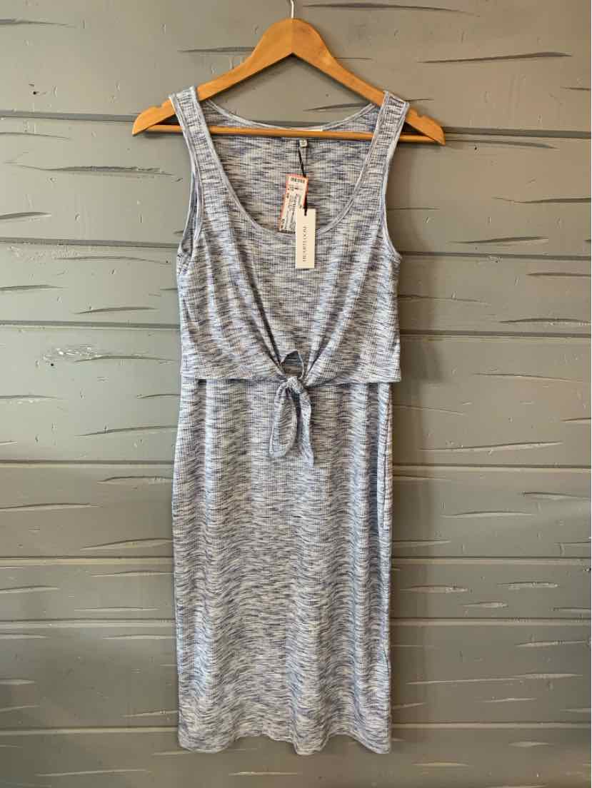 Sleeveless light blue knit dress with tie waist and scoop neckline on wooden hanger.