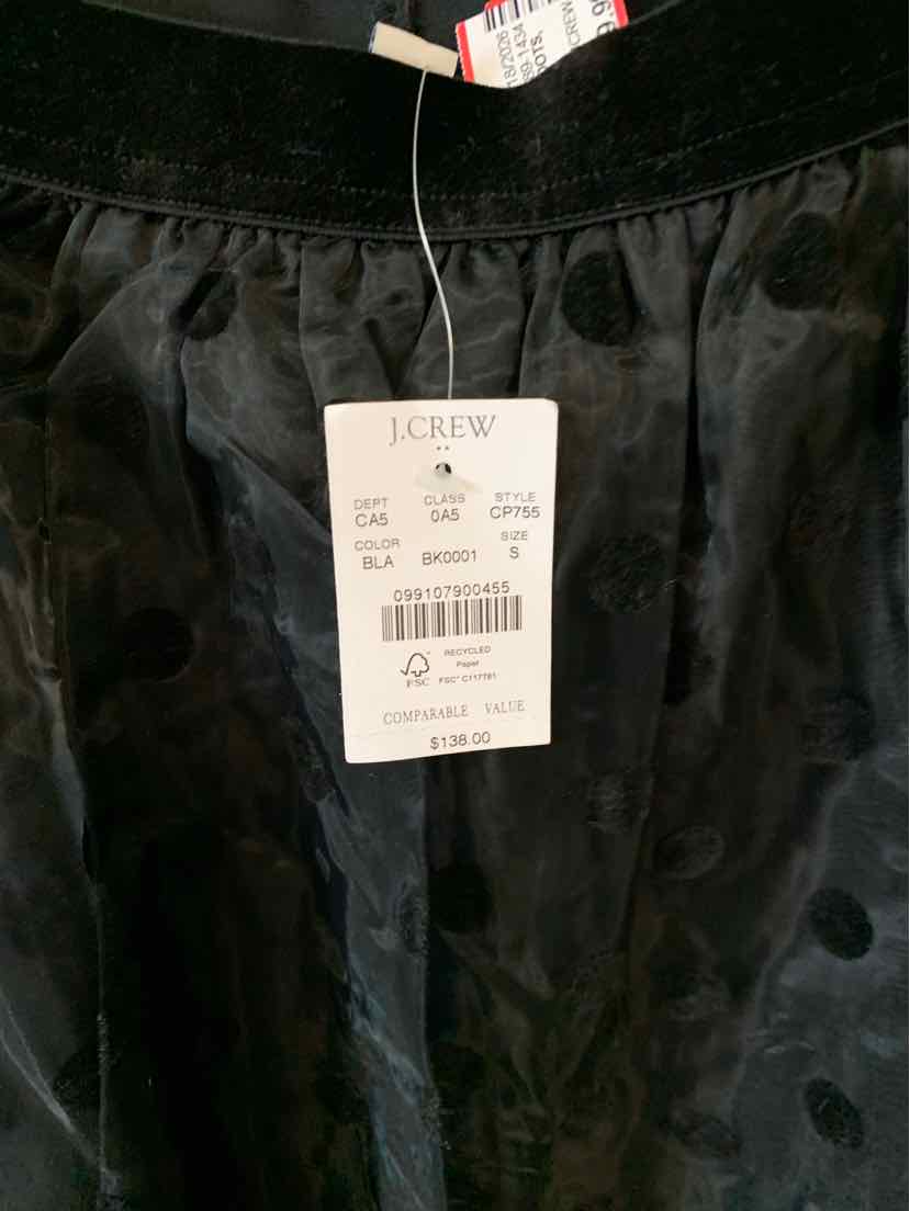 Black satin skirt with J.Crew tag and size small label attached.