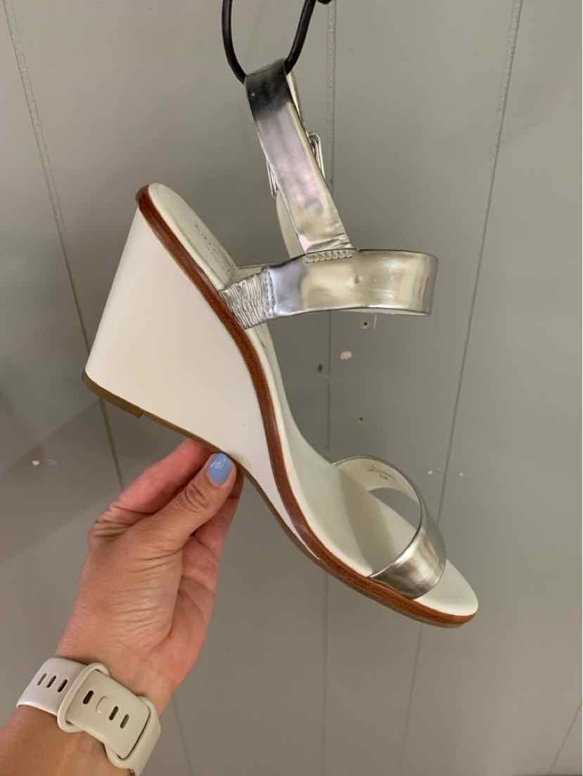 White wedge sandal with clear ankle strap and open toe, size 9.