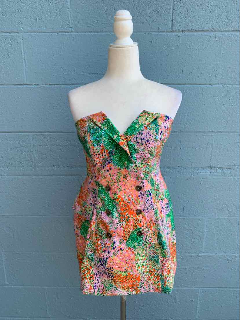 Strapless mini dress with vibrant multicolor floral and abstract print, fitted silhouette.