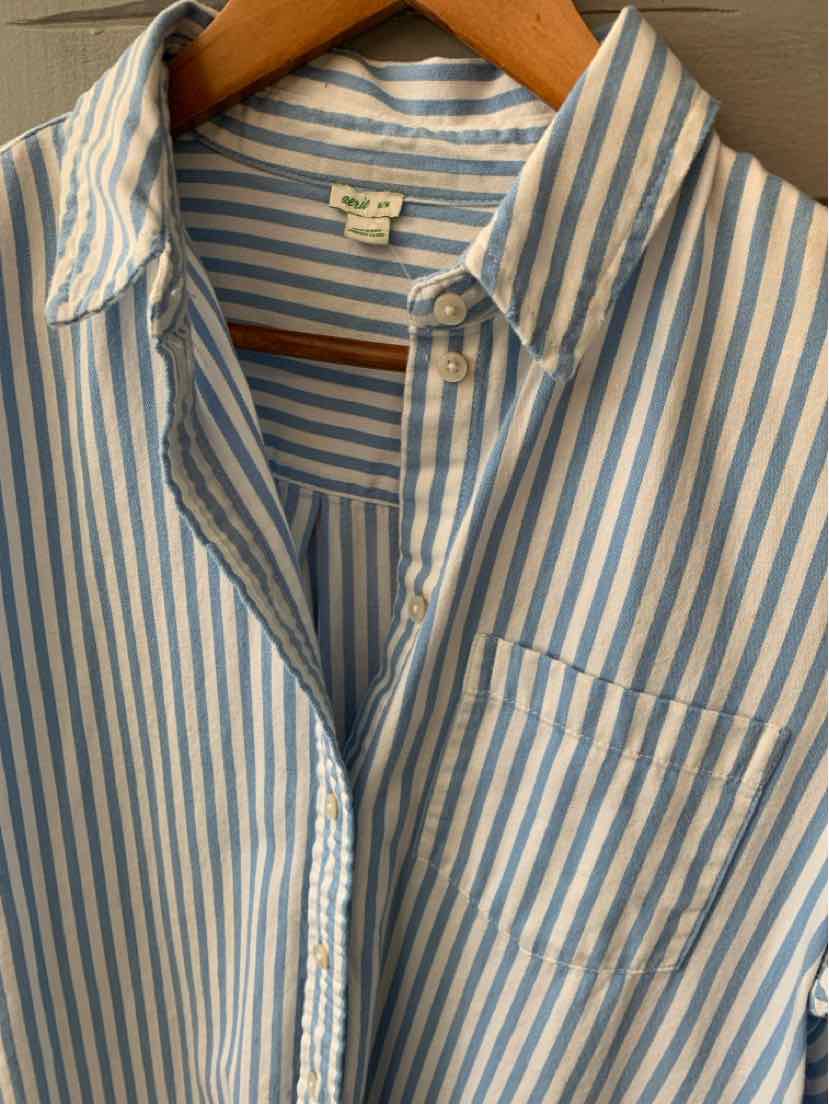 Blue and white vertical striped button-up shirt with collar and chest pocket on wooden hanger.