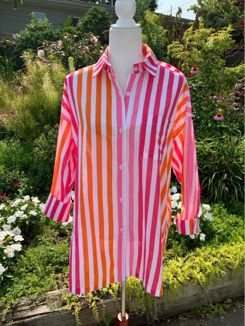 Long-sleeve button-up shirt with vertical pink, orange, and white stripes, collared neckline, and relaxed fit.