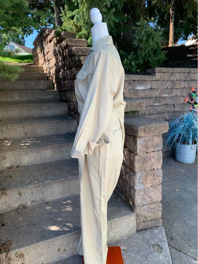 Tan long-sleeve button-up blouse and matching high-waist pants set with a relaxed fit on a white mannequin.