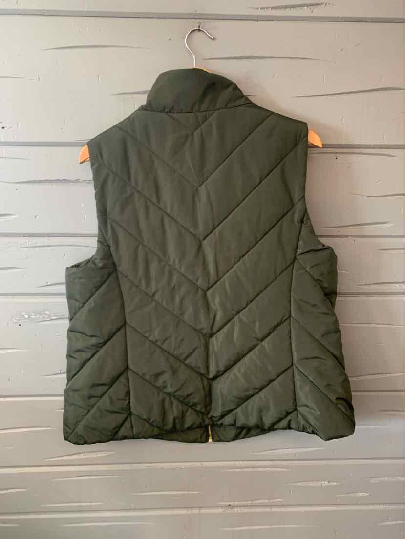 Dark green quilted sleeveless puffer vest with chevron stitching and stand collar.