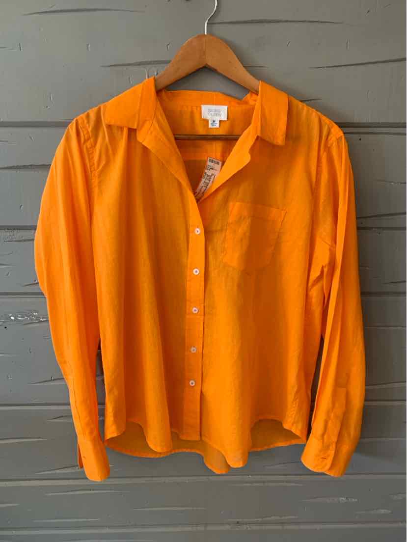 Bright orange long-sleeve button-up shirt with collar and chest pocket, made from lightweight fabric.