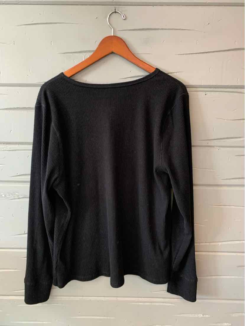 Black long-sleeve crewneck shirt in size 2X with a relaxed fit on a wooden hanger.