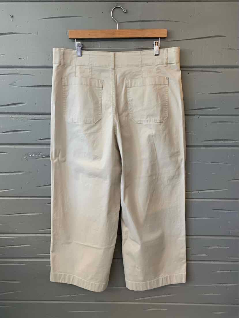 Tan wide-leg cropped pants in size 16 with back pockets and belt loops, made of cotton blend fabric.